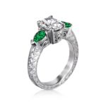 Oval Diamond Ring with Emerald Sides in Engraved Platinum